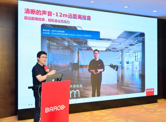 A person standing at a podium with a microphone
AI-generated content may be incorrect.