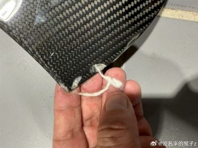 小米SU7 Ultra车主说明碳纤维机盖棉絮真相：防雨车衣所致，呼吁理性看待